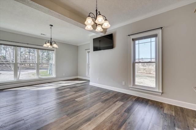 unfurnished dining area featuring a notable chandelier, crown molding, wood-type flooring, and a textured ceiling