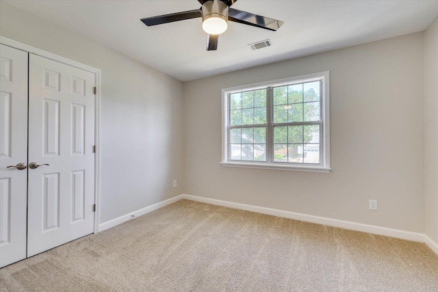 4142 Quinn Dr, Evans, GA 30809 - unfurnished bedroom featuring light colored carpet, a closet, and a ceiling fan
