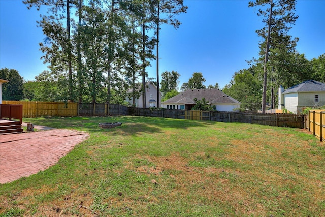 4142 Quinn Dr, Evans, GA 30809 - fenced backyard with a fire pit and a patio