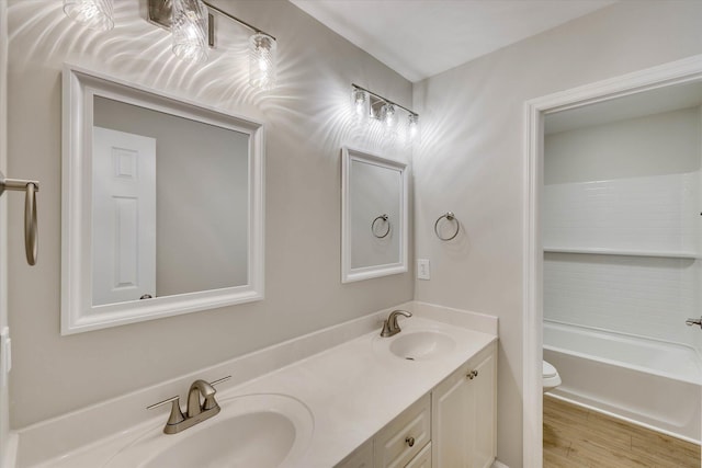 4142 Quinn Dr, Evans, GA 30809 - bathroom with double vanity, wood finished floors, and tub / shower combination