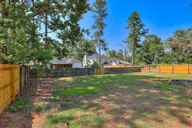 4142 Quinn Dr, Evans, GA 30809 - fenced backyard featuring a fire pit
