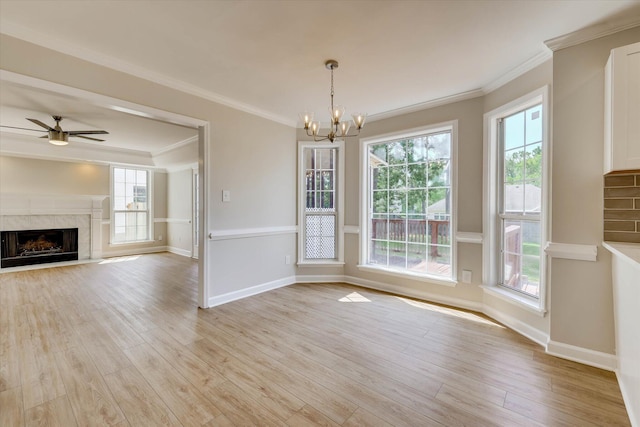 4142 Quinn Dr, Evans, GA 30809 - unfurnished dining area featuring a chandelier, light wood-type flooring, crown molding, a ceiling fan, and a premium fireplace