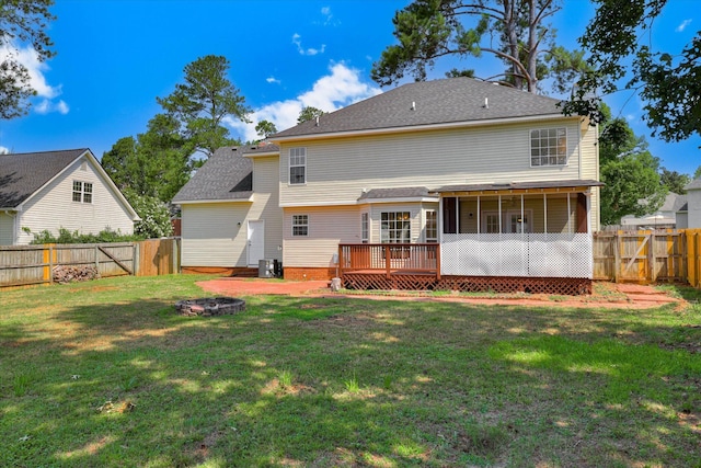 4142 Quinn Dr, Evans, GA 30809 - back of property with an outdoor fire pit, a fenced backyard, a sunroom, a deck, and roof with shingles