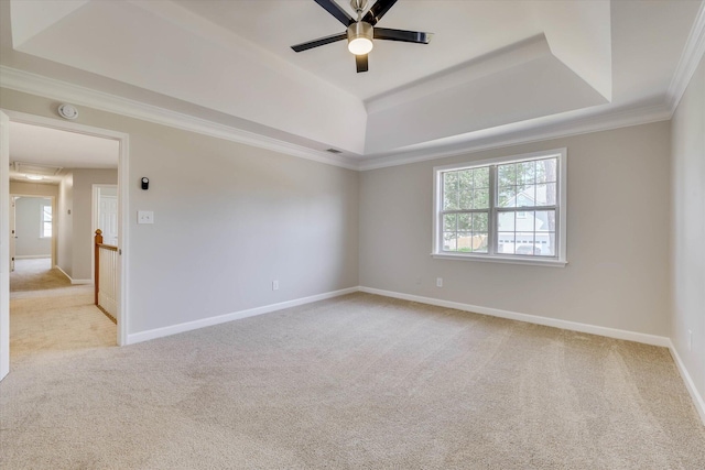 4142 Quinn Dr, Evans, GA 30809 - empty room featuring a raised ceiling, light carpet, ceiling fan, ornamental molding, and a smoke detector
