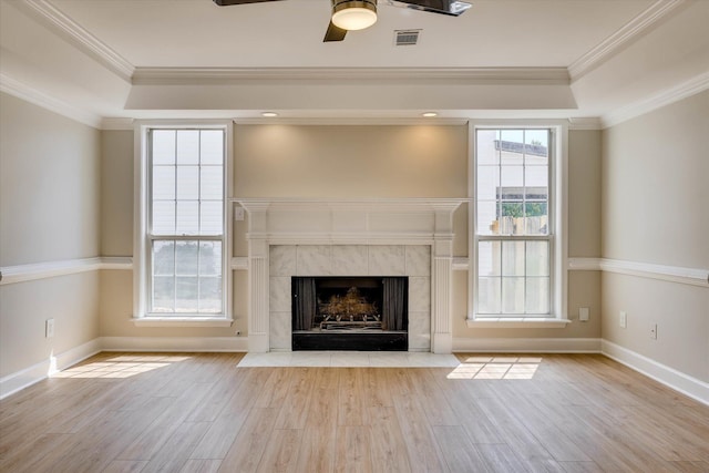 4142 Quinn Dr, Evans, GA 30809 - unfurnished living room with a tray ceiling, wood finished floors, ceiling fan, a premium fireplace, and ornamental molding
