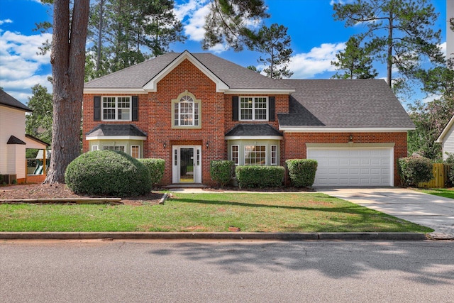 4142 Quinn Dr, Evans, GA 30809 - view of front of property featuring brick siding, concrete driveway, an attached garage, and roof with shingles