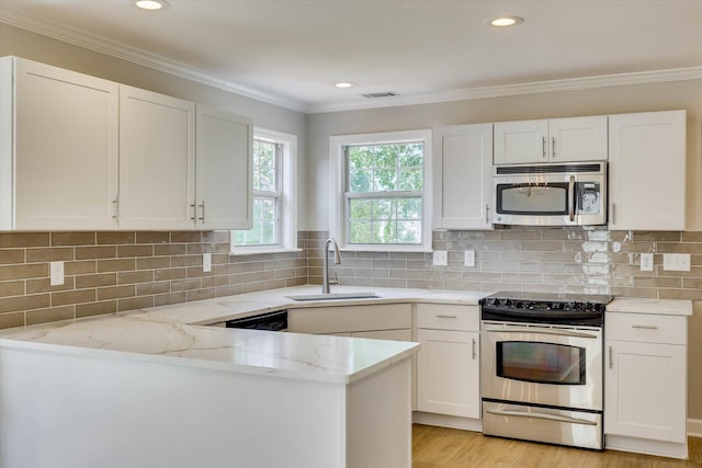 4142 Quinn Dr, Evans, GA 30809 - kitchen featuring stainless steel appliances, light stone counters, white cabinets, crown molding, and recessed lighting