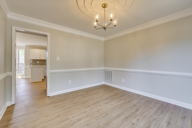 4142 Quinn Dr, Evans, GA 30809 - unfurnished room with light wood-style flooring, a chandelier, and ornamental molding