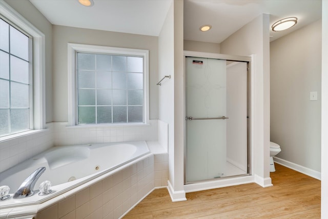 4142 Quinn Dr, Evans, GA 30809 - bathroom featuring a tub with jets, a shower stall, and wood finished floors