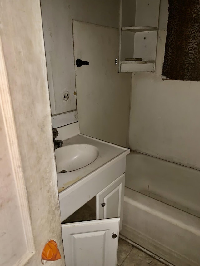 1555 Koger St, Augusta, GA 30904 - full bath with vanity, a tub to relax in, and tile patterned flooring