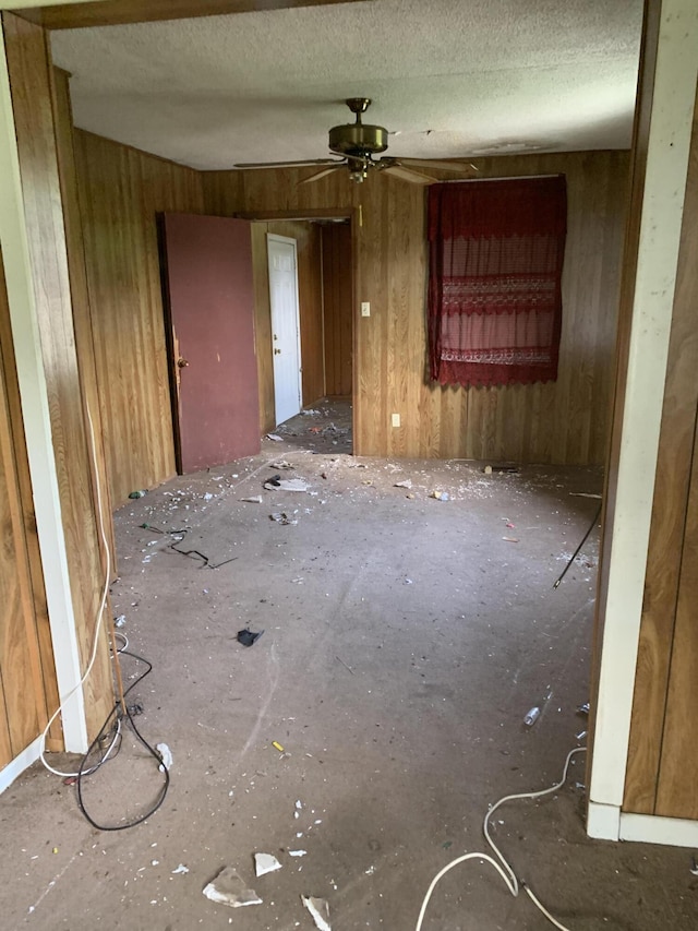 1555 Koger St, Augusta, GA 30904 - unfurnished room with ceiling fan, wood walls, and a textured ceiling