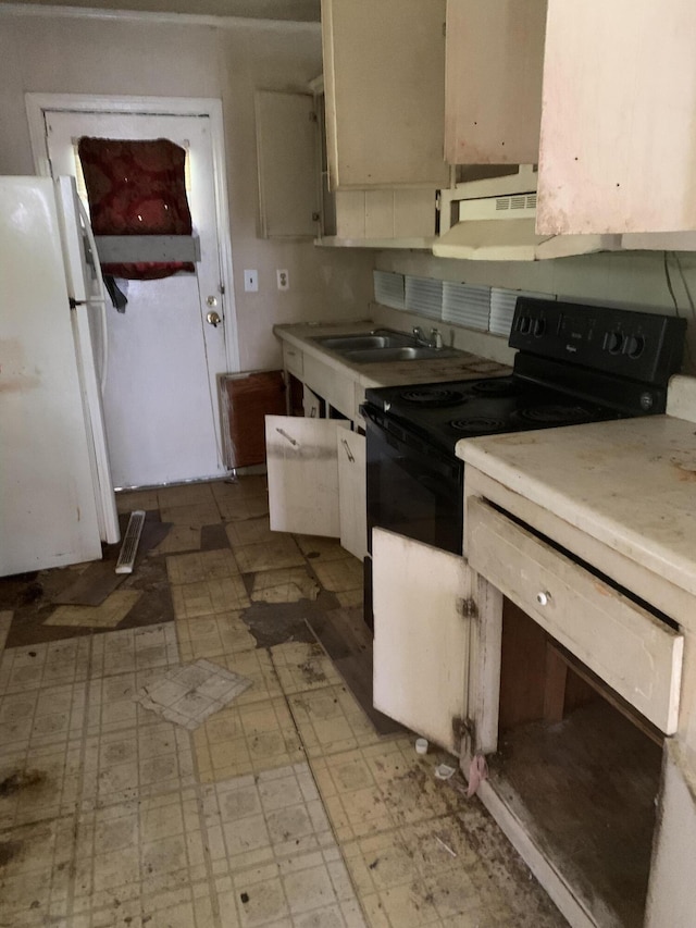 1555 Koger St, Augusta, GA 30904 - kitchen with freestanding refrigerator, black electric range oven, light floors, and light countertops