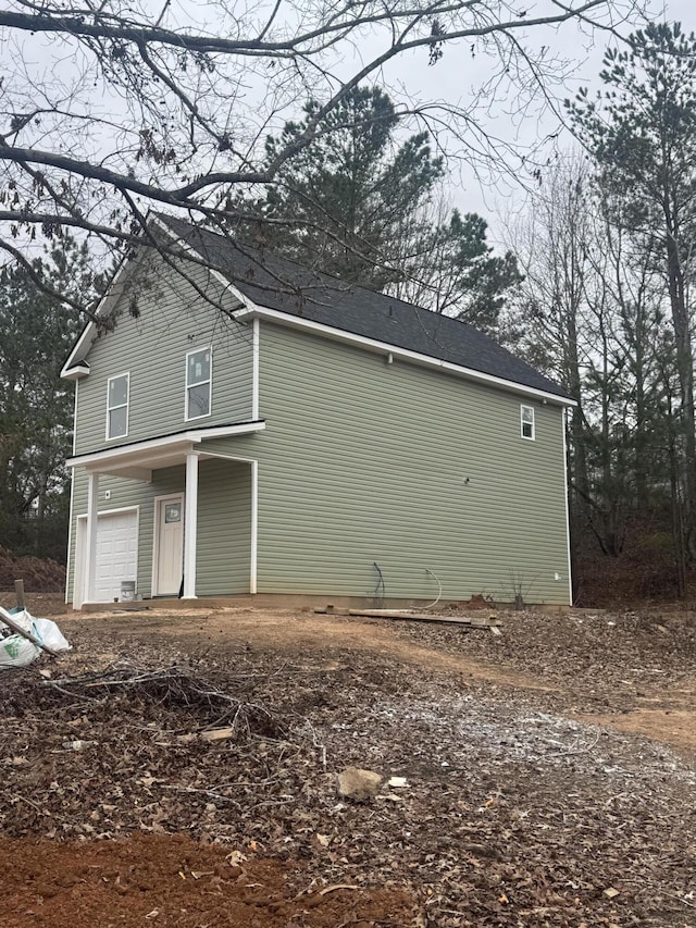 view of property exterior featuring a garage