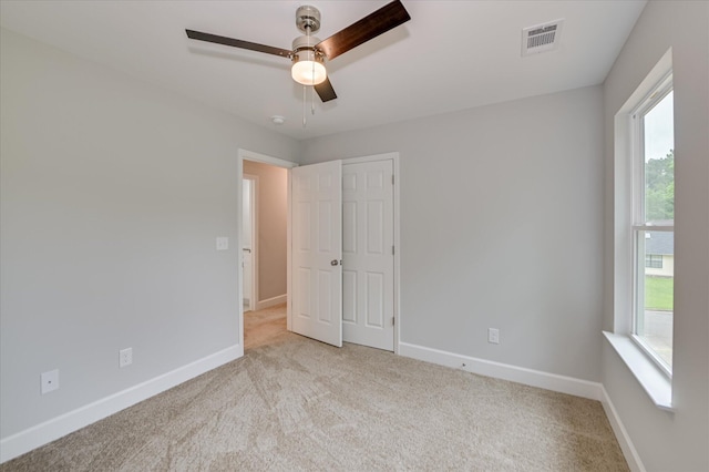 2815 Ridge Crest Dr, Hephzibah, GA 30815 - unfurnished bedroom with carpet flooring, baseboards, ceiling fan, and a closet