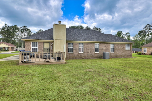 2211 Altman Way, Hephzibah, GA 30815 - back of house featuring brick siding, a yard, a deck, a chimney, and a shingled roof