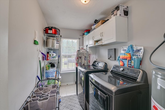 2211 Altman Way, Hephzibah, GA 30815 - laundry room featuring cabinet space, washer and clothes dryer, water heater, and tile patterned flooring