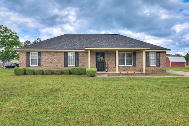 2211 Altman Way, Hephzibah, GA 30815 - view of front of house featuring a front lawn, a shingled roof, and brick siding
