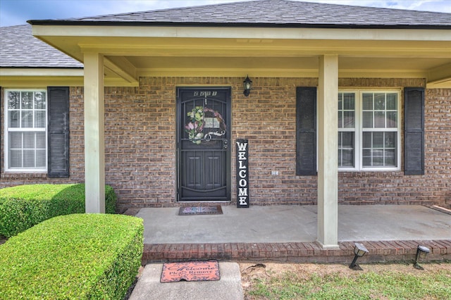 2211 Altman Way, Hephzibah, GA 30815 - view of exterior entry with a porch and brick siding