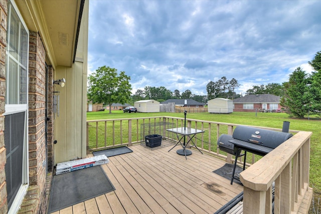 2211 Altman Way, Hephzibah, GA 30815 - wooden deck featuring grilling area, a yard, and an outdoor structure