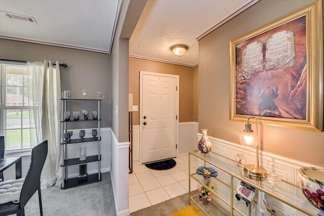 2211 Altman Way, Hephzibah, GA 30815 - foyer with wainscoting, tile patterned flooring, ornamental molding, and carpet flooring