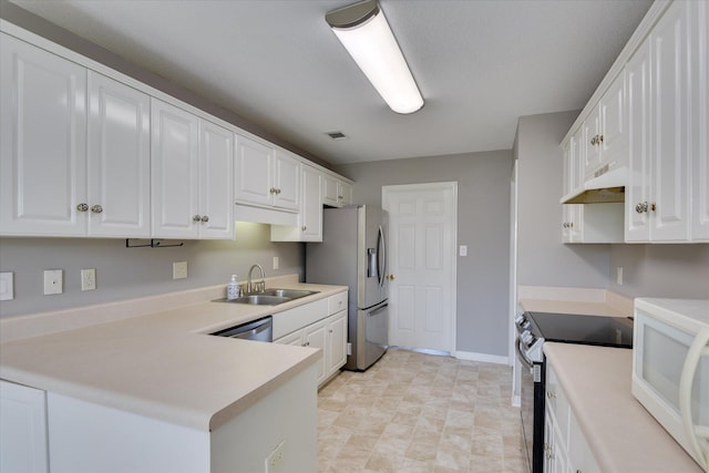 3643 Stanton Ct, Augusta, GA 30906 - kitchen featuring electric range, a sink, stainless steel fridge, white microwave, and under cabinet range hood
