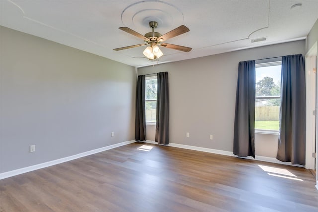 3643 Stanton Ct, Augusta, GA 30906 - unfurnished room with plenty of natural light, wood finished floors, and a ceiling fan