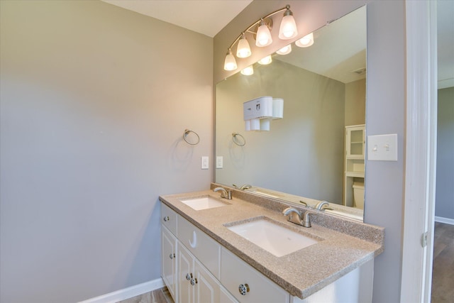 3643 Stanton Ct, Augusta, GA 30906 - bathroom featuring double vanity, baseboards, and wood finished floors