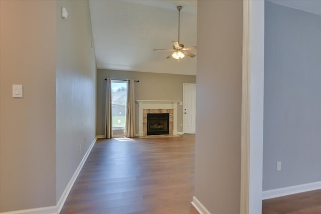 3643 Stanton Ct, Augusta, GA 30906 - unfurnished living room featuring ceiling fan, dark wood-type flooring, a tile fireplace, baseboards, and high vaulted ceiling