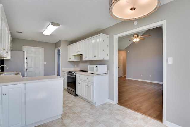 3643 Stanton Ct, Augusta, GA 30906 - kitchen featuring appliances with stainless steel finishes, a ceiling fan, a sink, white cabinets, and under cabinet range hood