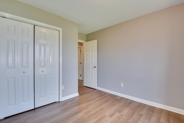 3643 Stanton Ct, Augusta, GA 30906 - unfurnished bedroom with light wood-style floors, baseboards, and a closet