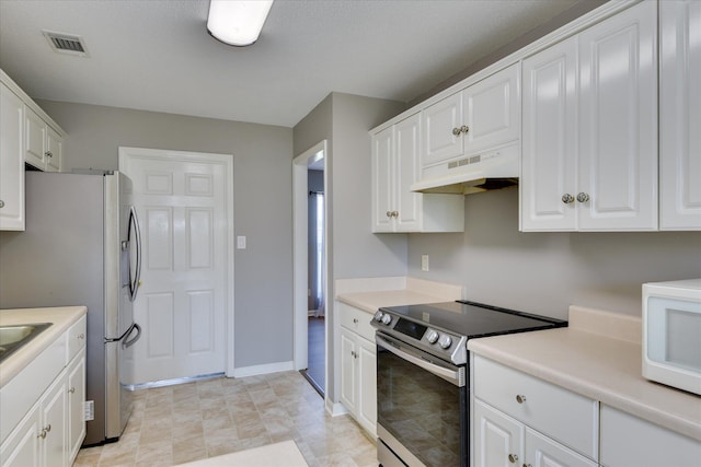 3643 Stanton Ct, Augusta, GA 30906 - kitchen with appliances with stainless steel finishes, under cabinet range hood, white cabinets, and light countertops
