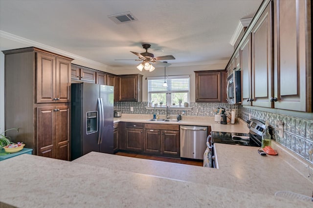 235 Baylor Dr, Graniteville, SC 29829 - kitchen featuring visible vents, decorative backsplash, ceiling fan, a sink, and stainless steel appliances