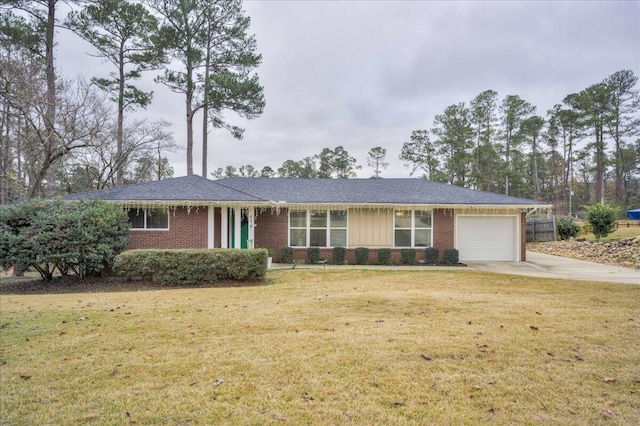 ranch-style home with a garage and a front lawn