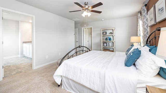 carpeted bedroom featuring ceiling fan and connected bathroom