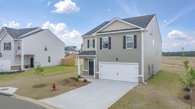 view of front facade with a garage and a front lawn