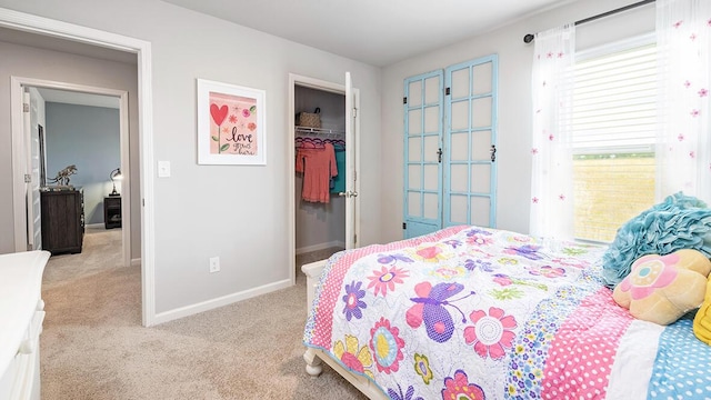 carpeted bedroom with a closet