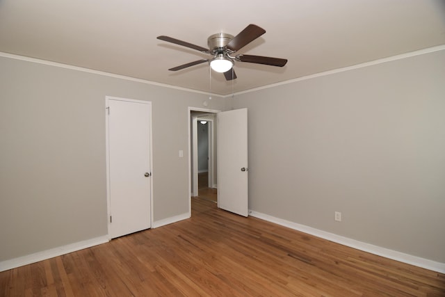 2320 Henry Cir, Augusta, GA 30906 - unfurnished bedroom with baseboards, crown molding, wood finished floors, and a ceiling fan