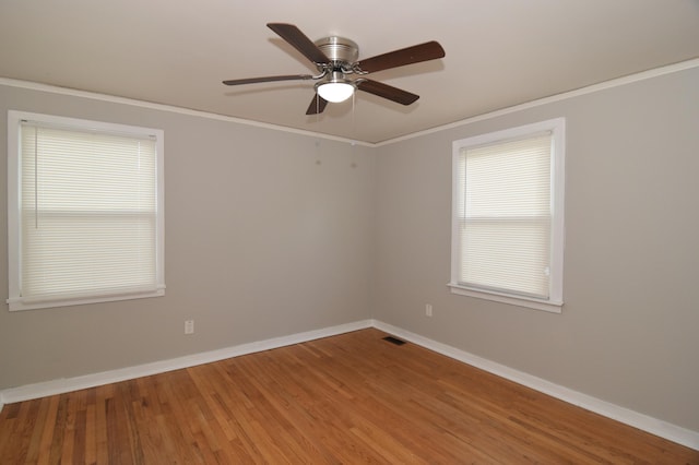 2320 Henry Cir, Augusta, GA 30906 - spare room featuring wood finished floors, a ceiling fan, baseboards, and crown molding