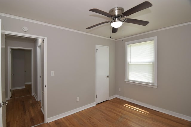 2320 Henry Cir, Augusta, GA 30906 - unfurnished bedroom with wood finished floors, baseboards, ornamental molding, and ceiling fan