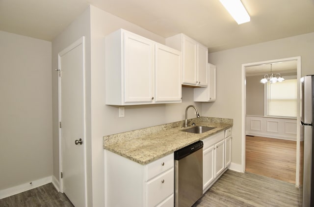 2320 Henry Cir, Augusta, GA 30906 - kitchen featuring appliances with stainless steel finishes, a sink, white cabinetry, and wood finished floors