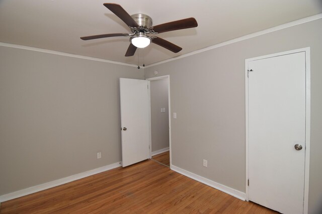 2320 Henry Cir, Augusta, GA 30906 - unfurnished bedroom featuring crown molding, baseboards, light wood-style floors, and ceiling fan