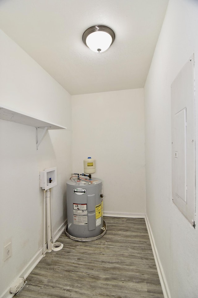 2320 Henry Cir, Augusta, GA 30906 - washroom with electric water heater, washer hookup, wood finished floors, baseboards, and electric panel