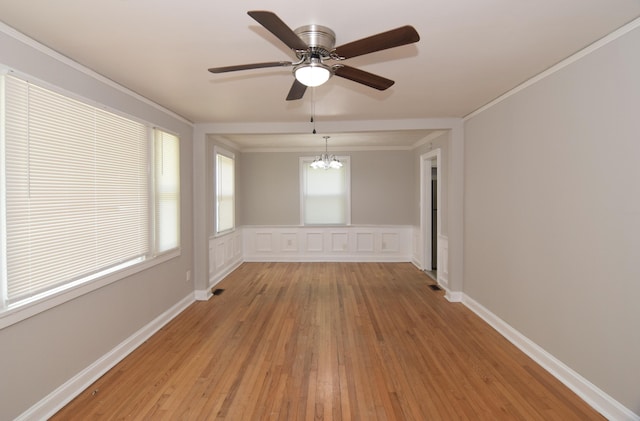 2320 Henry Cir, Augusta, GA 30906 - empty room with a chandelier, light wood-style flooring, ceiling fan, and crown molding