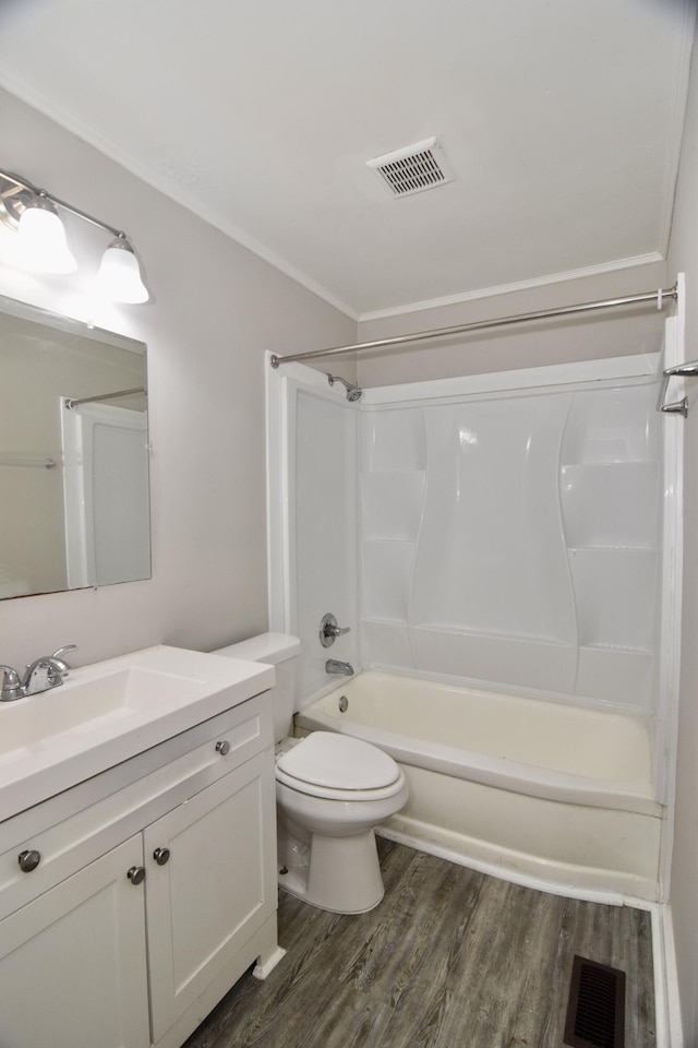 2320 Henry Cir, Augusta, GA 30906 - bathroom with wood finished floors, toilet, vanity, tub / shower combination, and ornamental molding