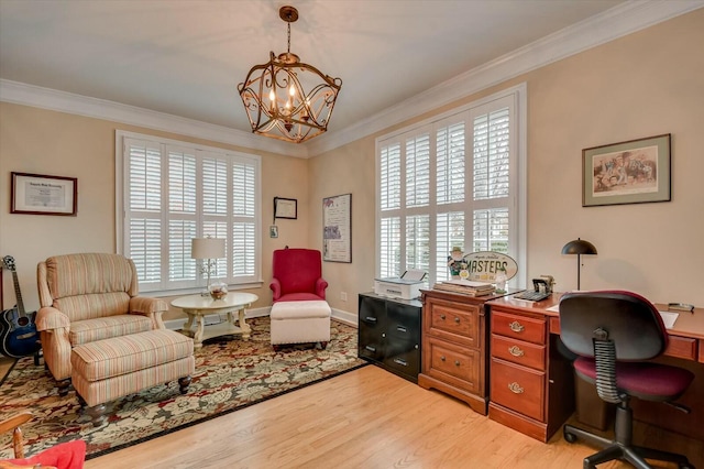 home office featuring a notable chandelier, light hardwood / wood-style floors, and crown molding