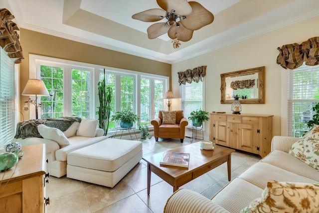 901 Patriots Pt, Mccormick, SC 29835 - living area with light tile patterned floors, a ceiling fan, plenty of natural light, crown molding, and a tray ceiling