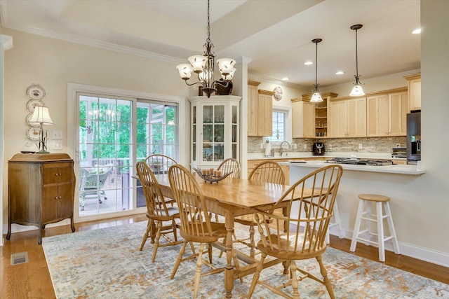 901 Patriots Pt, Mccormick, SC 29835 - dining space with ornamental molding, light wood finished floors, a chandelier, and recessed lighting