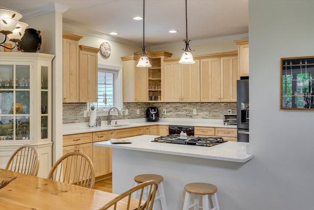 901 Patriots Pt, Mccormick, SC 29835 - kitchen with a sink, light brown cabinets, a breakfast bar area, decorative backsplash, and crown molding