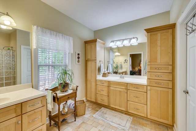 901 Patriots Pt, Mccormick, SC 29835 - bathroom featuring two vanities, a tile shower, and stone finish floors