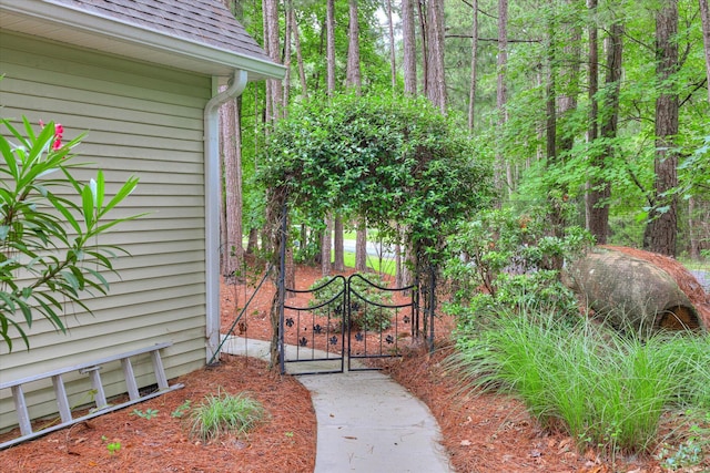 901 Patriots Pt, Mccormick, SC 29835 - view of exterior entry featuring a shingled roof and a gate